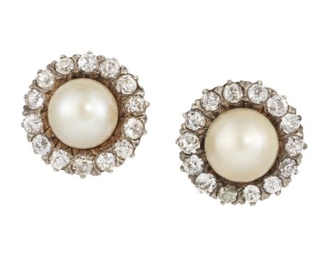 A PAIR OF CONTINENTAL SALTWATER PEARL AND DIAMOND EARSTUDS, the round pearls, approx. 6.7mm - 7.1mm diameter, surrounded by r