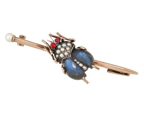 A FRENCH GOLD GEMSET INSECT BROOCH, the stylised beetle set with labradorite cabochon wings, seed pearl body and red hardston