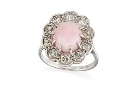 AN 18CT WHITE GOLD CONCH PEARL AND DIAMOND CLUSTER RING, the oval pale pink conch pearl, claw mounted and surrounded by old c