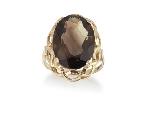 A 9CT SMOKEY QUARTZ RING, the oval faceted smokey quartz in a four-claw mount with a basket surround and plain band stamped '