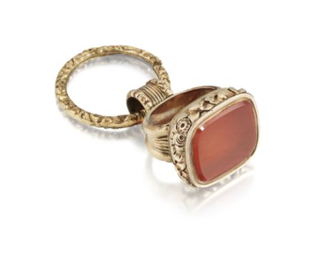 A LATE 19TH CENTURY HARDSTONE FOB, the rectangular carnelian fob in a deep repousse collet mount, with broad tapering, reeded