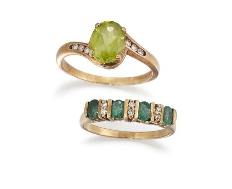 TWO 9CT DIAMOND AND GEMSET RINGS, the first a four stone emerald and diamond ring, size O; together with a peridot and diamon