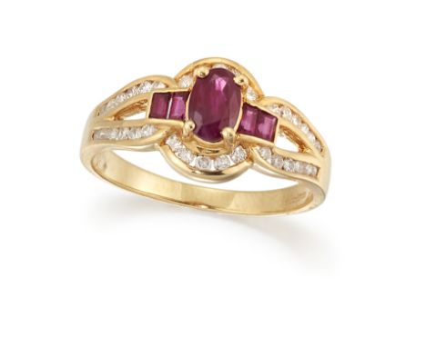 AN 18CT RUBY AND DIAMOND RING, the central oval ruby set to either side with two small calibre cut rubies, in an outer frame 