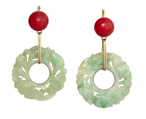 A PAIR OF JADE AND CORAL EARRINGS, the carved jade discs, 25mm diameter, suspended from links set with a round coral cabochon