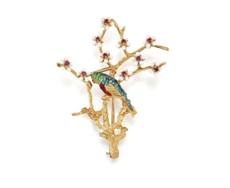 AN 18CT ENAMEL AND RUBY PARROT BROOCH, the polychrome parrot sat on textured gold branches set with white enamel flowers with