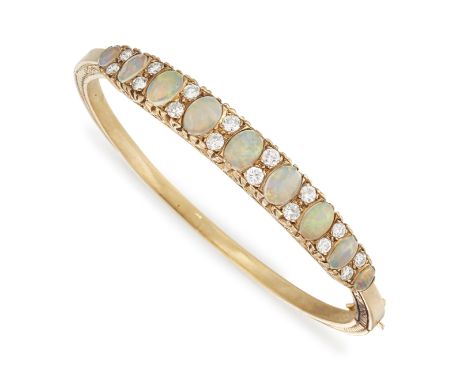 AN OPAL AND DIAMOND BANGLE, the nine graduated oval opal cabochons interspaced with round brilliant cut diamonds, total weigh