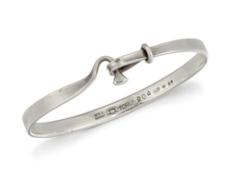 A GEORG JENSEN SILVER BANGLE,&nbsp;designed by Vivianna Torun, stamped marks and no.204. 6.3cm at the widest point