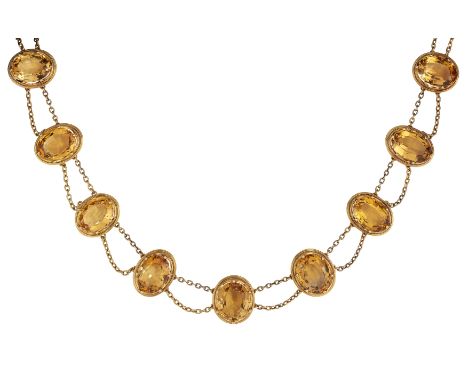 A CONTINENTAL CITRINE NECKLACE, the nine oval faceted citrines, all claw mounted with scalloped sides and fine rope twist bor