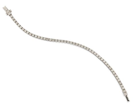 AN 18CT DIAMOND LINE BRACELET, comprised of round brilliant cut diamonds, total estimated approx. 5.30cts, all claw mounted i