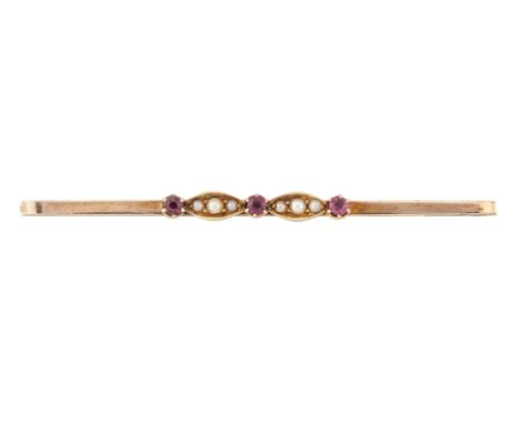 A 9CT RUBY AND SEED PEARL BAR BROOCH, the bar set with three small round rubies and interspaced with navettes of seed pearls,