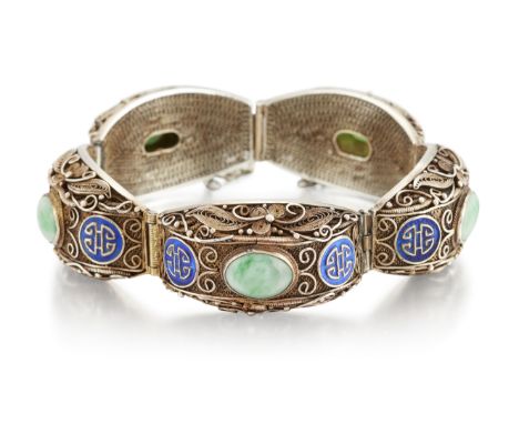A CHINESE SILVER-GILT JADE AND ENAMEL BRACELET, the broad filigree links set with an oval jade cabochon and blue enamel Chine