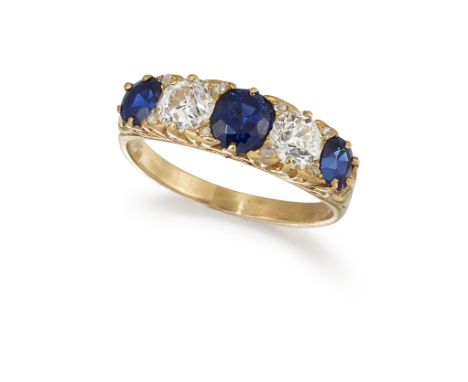A FRENCH SAPPHIRE AND DIAMOND RING, the three cushion cut sapphires set between with an old cut diamond and diamond highlight
