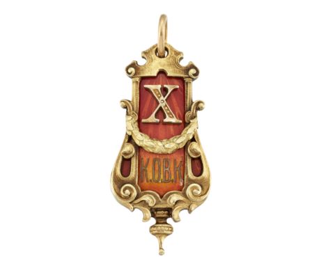 AN EARLY 20TH CENTURY RUSSIAN GOLD AND ENAMEL PENDANT, the amber coloured enamel pendant set with a large 'X' and letters 'K.