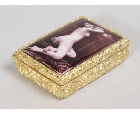 A 18CT GOLD PLATED ENAMEL SEPIA NUDE PILL BOX.