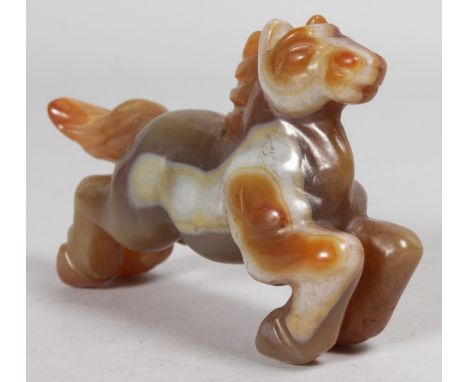 A CARVED JADE FLYING HORSE.  5ins long.
