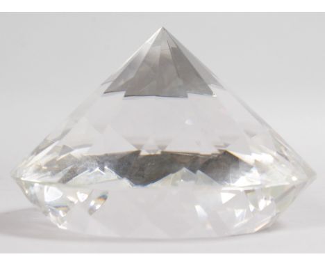 A LARGE CUT GLASS DIAMOND SHAPED PAPERWEIGHT. 6ins diameter.