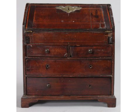 AN APPRENTICES 18TH CENTURY WALNUT AND OAK BUREAU with fall front over two short and two long drawers, supported on bracket f