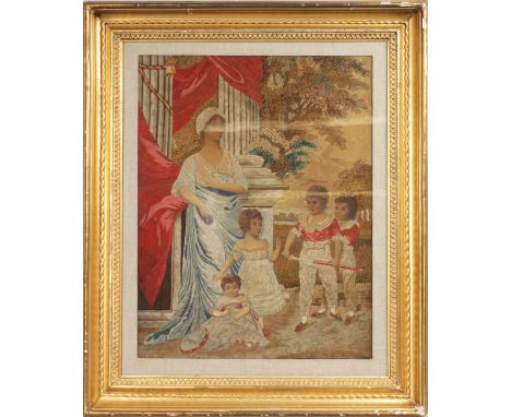 A GILT FRAMED VICTORIAN BRUSSELS TAPESTRY, mother and three children in a classical setting.