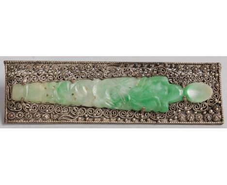 A SILVER FILIGREE JADE MOUNTED BROOCH.