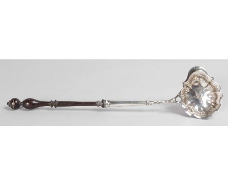 A GEORGE III PENCIL LADLE with turned wooden handle with crest. London 1795.