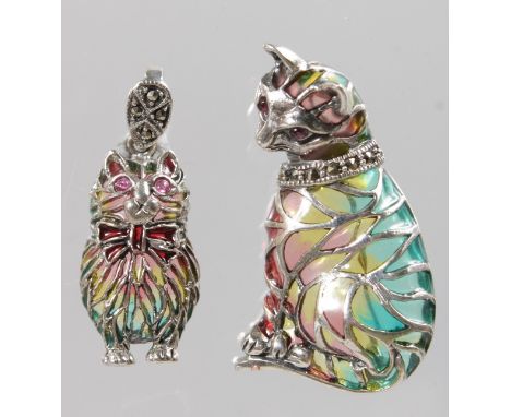 TWO SILVER, PLIQUE AND ENAMEL 'CAT' PENDANT with ruby eyes.