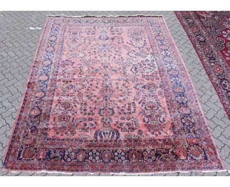 A GOOD LARGE HAMADAN CARPET, rust ground with all-over stylised floral decoration. 12ft 3ins x 8ft 11ins.