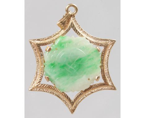 A 14K GOLD JADE SET STAR PENDANT.