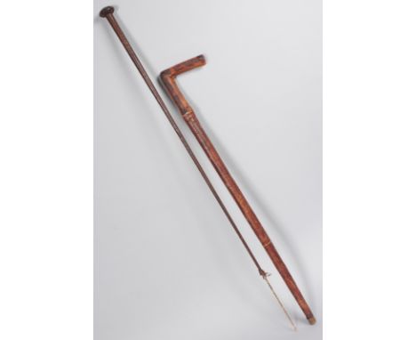 A LEATHER SWORD STICK AND RIDING CROP (2).