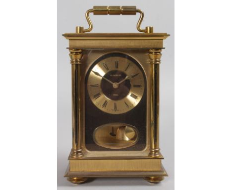 H. SAMUEL.  A BRASS CARRIAGE CLOCK. 7.5ins high.