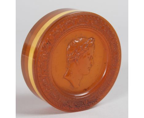 A REGENCY TORTOISESHELL CIRCULAR BOX AND COVER, the lid with a pressed portrait of Caesar. 3ins diameter.