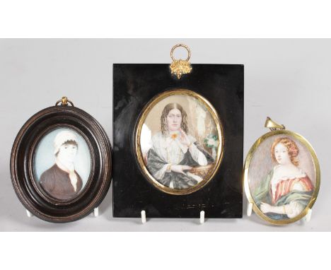 THREE FRAMED PORTRAIT MINIATURES OF LADIES.
