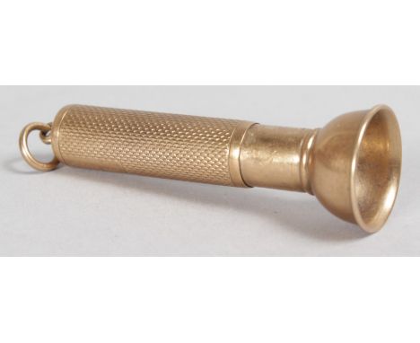 A 9CT GOLD ENGINE TURNED CIGAR CUTTER.