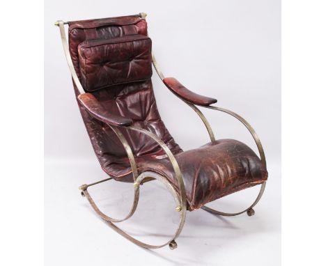 R. W. WINFIELD, A WROUGHT IRON ROCKING CHAIR, CIRCA. 1850, with buttoned burgundy leather upholstery.