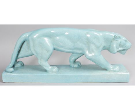 A LARGE ART DECO DESIGN LIGHT BLUE CRACKLE GLAZE PANTHER on a rectangular base. 26ins long.