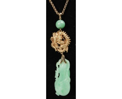 A LOVELY CHINESE CARVED JADE PENDANT on a gold chain.
