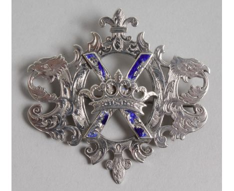 A SCOTTISH SILVER AND BLUE ENAMEL BROOCH.