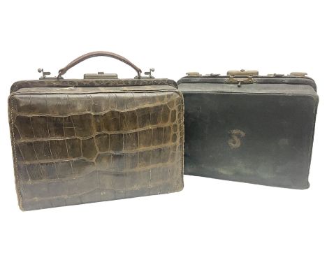 Early 20th century crocodile skin doctors bag, together with another similar doctors bag with fitted interior housing various