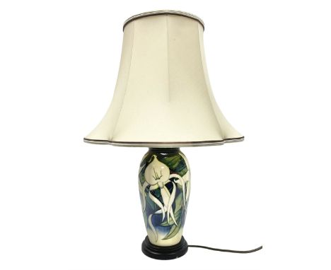 Moorcroft table lamp of baluster form, decorated with white flowers amongst foliage on merging dark blue and cream ground, ra