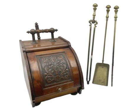 Victorian mahogany coal scuttle, the domed rolling lid carved with ornate foliate motifs opening to reveal interior with twin