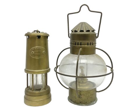 Ships brass onion oil lamp, with clear glass globular shade and wedge burner, together with a Lamp &amp; Limelight miners lam