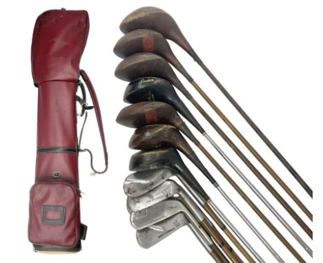 Approximately twenty-three golf clubs, to include early 20th century examples, Spalding Bruce Devlin Gold Line Ply Power and 