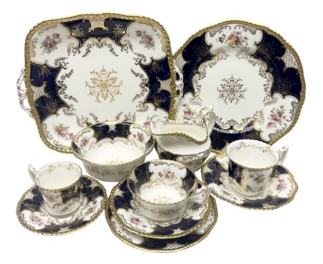 Coalport cobalt blue batwing pattern tea wares, decorated with finely enamelled floral sprays within gilt reserves, comprisin