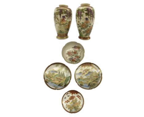 Japanese satsuma comprising a pair of ovoid form vases, each decorated with a butterfly amongst wisteria and other flowers, H