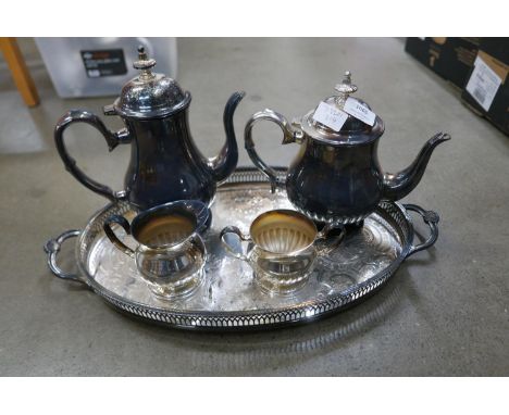 A silver plated four piece tea service and gallery tray **PLEASE NOTE THIS LOT IS NOT ELIGIBLE FOR POSTING AND PACKING** 
