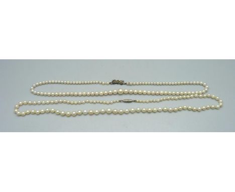 Two cultured pearl necklaces, one with a silver clasp 