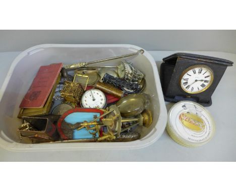 A travel clock, pocket watch, car badge, etc. 