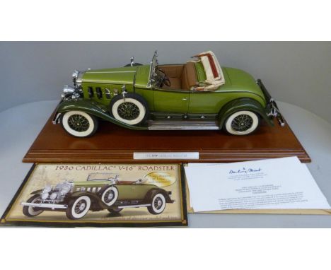 A Danbury Mint 1:12 scale 1930 Cadillac V-16 Roadster on a wooden plinth, with brochure and certificate 