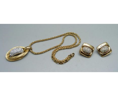 A Christian Dior 1975 pendant on chain and a pair of similar Christian Dior earrings marked Grossé 1975 