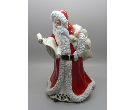 A Royal Doulton Father Christmas figure, HN3399, (three small chips on the hood of the cloak)
