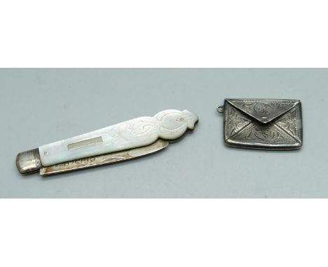 A Victorian silver bladed fruit knife with mother of pearl handle and a sterling silver stamp case 